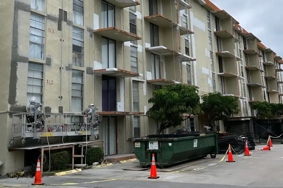 Deteriorated concrete with exposed reinforcing steel on a South Florida building exterior